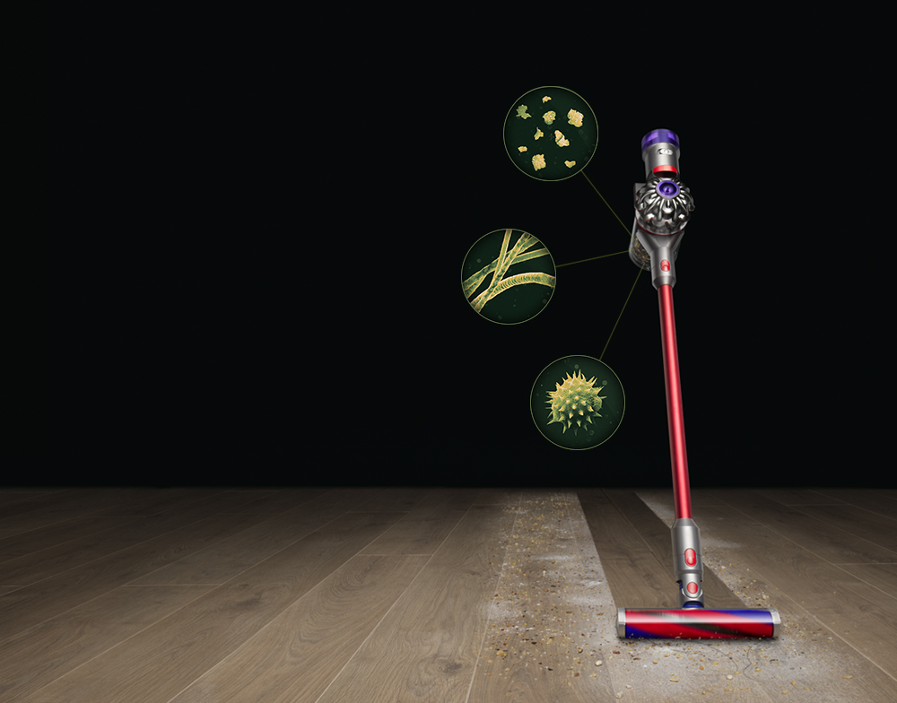Dyson V8 Slim cleaning cleaning dust from a hard floor