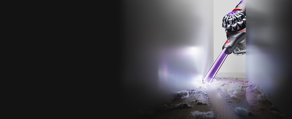 The Dyson V8 Slim Light-up crevice tool cleaning in a narrow gap